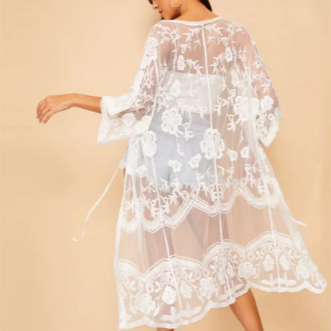 Discover the perfect blend of style and comfort with our Elegant Lace Sheer Mid-Length Coverup, designed for women. This versatile coverup features a one-size-fits-most design, ensuring a flattering fit for various body types, including plus sizes—though it may appear shorter for those sizes. Available in two timeless colors, black and white, this coverup is ideal for layering over your favorite swimwear. Please note that the bikini is not included; this listing is for the coverup only.