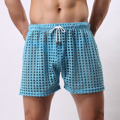 Sheer fishnet mesh trunks displayed on a mannequin, designed for unisex wear, showcasing the sheer material and stretchy waistband.